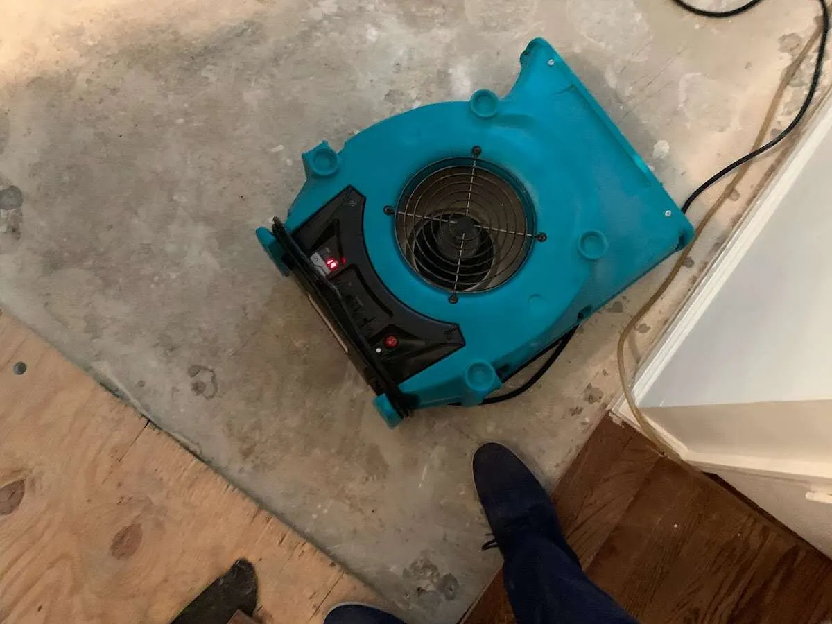 Air mover drying subfloor during Leak Detection & Repair in Middleburg Heights